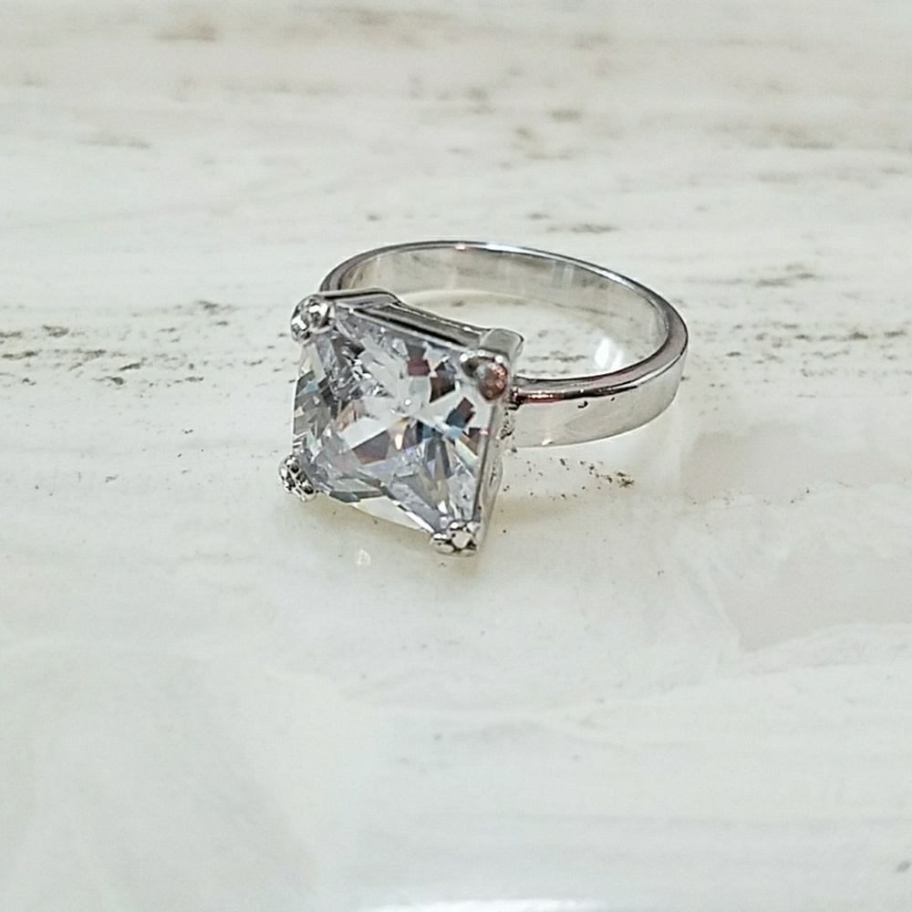 925 stamped silver band w/ impressive CZ.